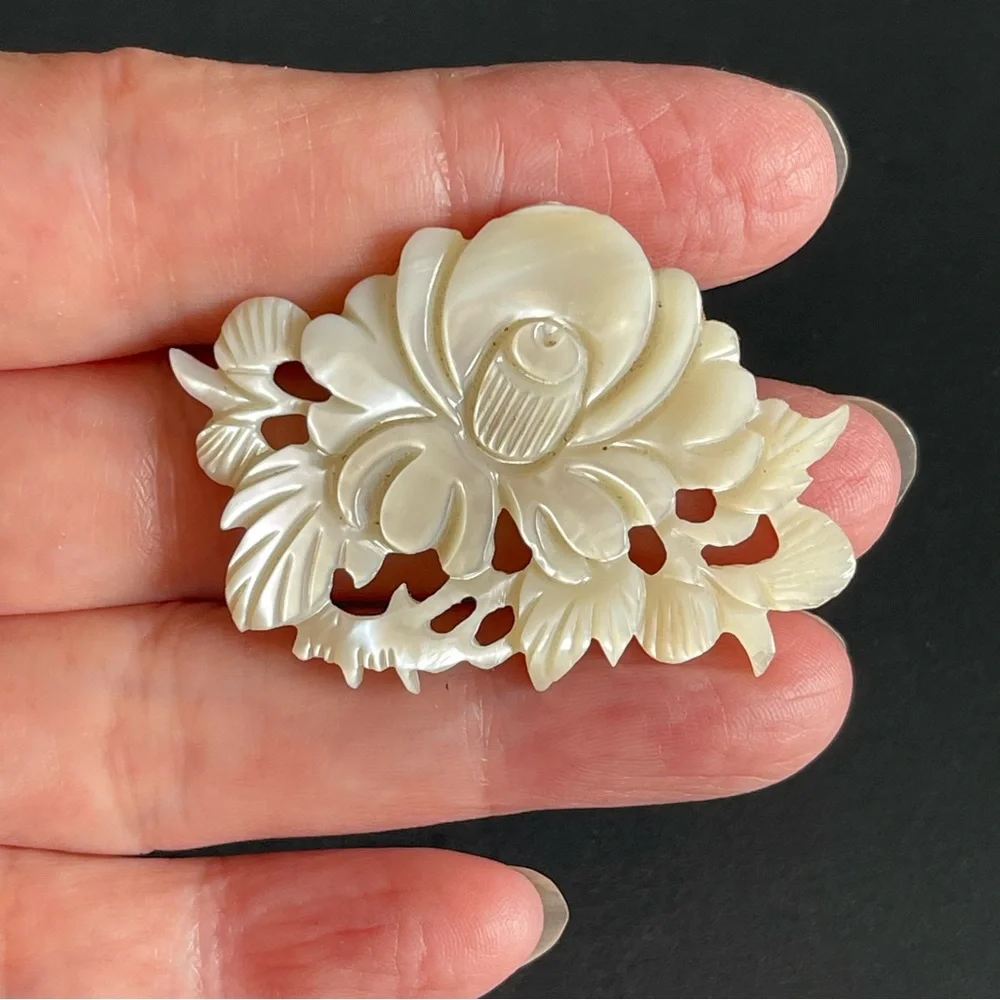 Vintage carved mother of pearl brooch.